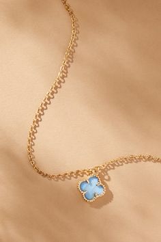 Simplicity in design but elegant in its statement, this 14K gold clover charm necklace is timeless in your jewelry box. Featuring a light blue clover charm outlined in gold and displayed on a dainty gold chain, this necklace creates an aura of beauty radiating from within and encapsulating its wearer. Elegant Blue Charm Necklace With Adjustable Chain, Elegant Blue Gold-plated Charm Necklace, Dainty Gold Chain, Clover Charm, Gold Dipped, Accessories Jewelry Necklace, Altar'd State, Floral Romper, Dream Jewelry