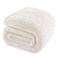 a white blanket folded on top of each other