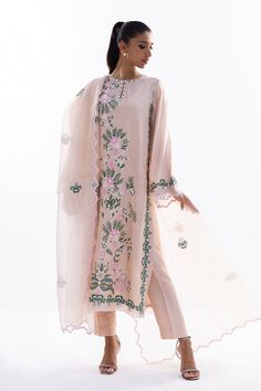 This timeless long shirt silhouette is cut from khaddi silk and is rendered with our signature floral embroidery. An organza dupatta with worked borders and rawsilk trousers complement the look. Elegant Churidar With Floral Embroidery And Traditional Drape, Elegant Churidar With Floral Embroidery In Chanderi, Elegant Chanderi Churidar With Floral Embroidery, Spring Tissue Silk Kurta With Resham Embroidery, Elegant Embroidered Cotton Silk Churidar, Spring Resham Embroidery Tissue Silk Kurta, Designer Tissue Silk Kurta For Spring, Spring Designer Tissue Silk Kurta, Festive Floral Embroidered Organza Palazzo Set