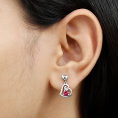 Product Details Be Dazzle and Flaunt your Style with these Unique Design Heart Drop Earrings. The Drop Earrings are embellished with Round Shape Created Ruby as Center Stone in 3 Prong Setting. Tiny Round Shape Diamond studded Beautifully on Solid Gold crafted Heart in Accent Setting that make it more Attractive. Product Information SKU SHP-EARRINGS052174859 Length 17 mm Width 9.4 mm Weight 1.69 gm (Approximate) LAB CREATED RUBY INFORMATION No.of Stones 2 Pieces Total Weight 0.68 Carat (Approxim Valentine's Day Round Diamond Earrings, Valentine's Day Diamond Heart Earrings With Round Cut, Valentine's Day Diamond Cut Round Diamond Earrings, Exquisite Round Ruby Earrings, Red Ruby Round Diamond Earrings, Heart Drop Earrings, Drop Earring, Diamond Studs, Round Shape