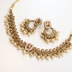 Classic heavy-look white, gold, and silver detailing set (necklace and earrings). Hand-done pearly beadwork. Absolutely ravishing set. Fully adjustable necklace  Earring length: 2 inch Earring width: 1.5 inch **Looking to bundle/add-on? Message me for an additional 5% off your cart! Always gift wrapped & dispatched with free, tracked shipping 🧡 All photos are taken in natural lighting without editing, but our jewelry is really shiny so it may reflect a little differently in different lighting! White Pearl Jewelry Sets For Diwali, White Hand-set Temple Jewelry Sets, Bollywood Style White Pearl Jewelry Sets, White Pearl Bollywood Jewelry Sets, White Kundan Necklace For Eid, Temple Jewelry Style, South Indian Jewellery, Polki Jewellery, Indian Jewelry Sets, Bollywood Jewelry