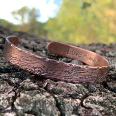 A rustic handmade bracelet that celebrates the beauty of nature and the majesty of the forest with the tree bark texture of this solid copper cuff bracelet. The inside is the perfect place to have your gift personalized with a secret message of love. This engraved copper bracelet is hand forged and finished with a hammered finish to give it a rustic look, perfect for men and women alike. Each bracelet is handmade, and no two will be exactly alike. Also please be aware that colors may vary due to Electroformed Copper Cuff Bracelet Gift, Rustic Bangle Cuff Bracelet As Gift, Handmade Rustic Bronze Bracelets, Brown Copper Cuff Bracelet As Gift, Rustic Stamped Cuff Bracelet Gift, Stamped Copper Cuff Bracelet For Gift, Stamped Copper Cuff Bracelet As Gift, Handmade Rustic Copper Cuff Bracelet, Handmade Rustic Cuff Bracelet As Gift