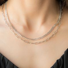 Elegant and timeless, this stainless steel silver necklace is the perfect blend of sophistication and simplicity. Crafted from high-quality stainless steel, it features a delicate chain that drapes gracefully around the neck. The necklace shines with a polished finish, offering a versatile accessory that complements both casual and formal attire. Its minimalist design makes it ideal for layering or wearing solo as a statement piece. Whether you're dressing up for an evening out or adding a touch Trendy Silver Stainless Steel Charm Necklaces, Everyday Silver Stainless Steel Chain Necklace, Modern Silver Clavicle Chain Necklace, Modern Sterling Silver Double Chain Necklaces, Modern Sterling Silver Necklaces With Double Chain, Modern Sterling Silver Double Chain Necklace, Trendy Silver Stainless Steel Chain Necklace, Trendy Silver Necklace For Everyday, Silver Clavicle Chain Link Necklace