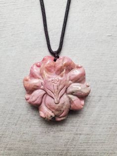 "Natural carved Rhodonite fox necklace, pink 9 tailed fox pendant, rhodonite necklace, gemstone carving animal necklace, Christmas gift for her You will receive the exact one as pictures and video as you choose from different fox necklaces! It is natural pink rhodonite with natural inclusions/other minerals that results in impurities we see in the rhodonite (impurities colors include black, dark green, clear, cream, gold etc.). There's no major flaws like big cracks on these Rhodonite carvings a Carved Spiritual Jewelry Gift, Spiritual Carved Jewelry As Gift, Carved Amulet Jewelry For Gifts, Carved Amulet Jewelry For Gift, Artisan Carved Necklaces As A Gift, Spiritual Carved Pendant Necklace, Carved Amulet Pendant Necklace, Carved Pendant Necklace Amulet Style, Carved Pendant Amulet Necklace