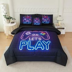 a bed with a neon sign on it that says let's play