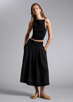 Smocked Waist Midi Skirt - Black - Midi skirts - & Other Stories US Casual Midi-length Bottoms With Gathered Waist, Casual Bottoms With Gathered Waist, Midi Length, Casual Midi Bottoms With Gathered Waist, Versatile Solid Skirt With Elastic Waistband, Versatile Solid Color Skirt With Elastic Waistband, Casual Viscose Lined Maxi Skirt, Casual Viscose Maxi Skirt With Lining, Casual Midi Length Skirt With Gathered Waist, Summer Flared Skirt Made Of Viscose