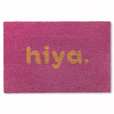 a pink door mat with the word hiya written on it