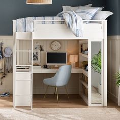 a white loft bed with desk and chair in the corner next to a wall mounted computer