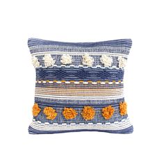 a blue and white pillow with orange pom poms