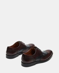 Experience the timeless style and sophistication with our EDREES dress shoes. Made with a genuine leather upper and featuring a classic wingtip design, these lace-up dress shoes blend perfectly with any formal outfit. Elevate your wardrobe with these expertly crafted, stylish, and comfortable dress shoes. 1 inch heel height Leather upper material Textile and synthetic lining Textile and synthetic sock Rubber sole Imported Lace-up Dress Shoes With Goodyear Welt For Business Casual, Business Casual Lace-up Dress Shoes With Goodyear Welt, Semi-formal Oxford Derby Lace-up Shoes, Lace-up Dress Shoes With Perforated Toe Box For Work, Formal Derby Shoes With Textured Sole And Lace-up, Formal Lace-up Derby Shoes With Textured Sole, Formal Lace-up Derby With Textured Sole, Wingtip Oxford Lace-up Shoes With Textured Sole, Formal Goodyear Welted Oxford Shoes