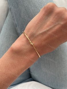 All Our Bracelets Are Made Of REAL 14K GOLD  14K yellow Gold Love Knot Cuff Bangle Bracelet, Real Gold Bangle, Stackable Bangle, Women  Shop our 14K Bracelets https://www.etsy.com/shop/GOLDMANIA?ref=seller-platform-mcnav§ion_id=26925987  Shop On Sale items https://www.etsy.com/shop/GOLDMANIA?ref=seller-platform-mcnav§ion_id=1  Metal: 14K Yellow Gold    Width: 2 MM  Length: 7 IN  Closure: Cuff Weight: 2.80 Gram   Knot dimension: 5 mm   SHIPPED FROM NEW YORK CITY FREE SHIPPING on all orders IN THE Dainty Bangle Cuff Bracelet For Anniversary, Dainty Anniversary Cuff Bracelet Bangle, 14k Gold Bangle For Gifts - Fine Jewelry, 14k Gold Bangle Fine Jewelry Gift, Yellow Gold-plated Bangle For Gift, Yellow Gold-plated Bangle As Gift, Yellow Gold Plated Bangle As A Gift, Gold 14k Wedding Bangle, Yellow Gold Plated Cuff Bracelet For Wedding