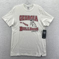 New '47 Brand University Of Georgia Bulldogs Short Sleeve T-Shirt Men's Medium New With Tags In Excellent Condition Measurements Are Posted For You To Look At Within The Listing Photos Prior To Purchase Enjoy Lightning Fast Shipping Message Response Times I Ship Items Every Day, You Can Expect Your Order To Be Sent Out Within 1 Business Day And Tracking Provided Browse Our Store To See Other College Ncaa Apparel And More! Plain Black Tee, Bulldogs Shirt, Georgia Bulldogs Shirt, Nascar T Shirts, Bulldog Shirt, University Of Georgia, Grey Tee, 47 Brand, Georgia Bulldogs