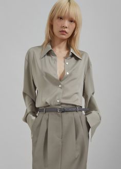 Color: Khaki Lightweight fluid fabric Regular fit Pointed collar Drop shoulders Button cuffs Front button closure Unlined 97% Polyester 3% Rayon Dry Clean By The Frankie Shop. Imported The Frankie Shop, Frankie Shop, Color Khaki, Button Up Shirt, Drop Shoulder, Woven Fabric, Button Up Shirts, Button Up, Dry Clean