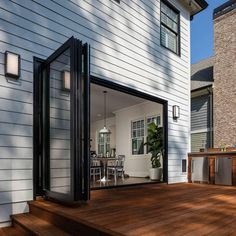 an open patio door leading to a deck