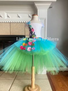 Welcome to Little Dreams by Mayra This dress is absolutely adorable and puffy! Just perfect for any birthday party, halloween, pageant or any occasion , your little one will look just adorable! Dress has three layers of tulle, Top has a handmade design in the front of the top only *If you need a different color just send me a message When selecting length you will select the longer layer in the back from armpit to floor, the front of the dress is shorter, if you wish to have the whole dress one length just let me a note at checkout  5'' crochet top will be used for sizes nb to 2T 8'' crochet top will be used for sizes 3T to 8years 10''crochet top will be used for sizes 9-10years 12''crochet top will be used for sizes 12years Shipping My orders are usually ready to ship in 7 business days, Whimsical Green Tutu Dress For Dress-up, Spring Princess Dress In Tulle For Costume Party, Spring Tulle Princess Dress For Costume Party, Spring Princess Dress With Tulle For Costume Party, Fairy Kei Dress For Spring Dress-up, Spring Party Tutu Dress, Spring Party Fun Tutu Dress, Fun Spring Party Tutu Dress, Fitted Fairy Dress For Spring Pageant