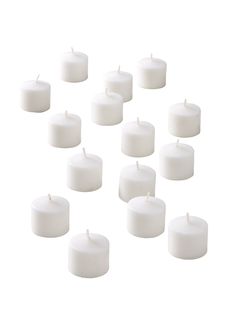 many white candles are lined up together