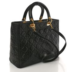 This is an authentic CHRISTIAN DIOR Lambskin Cannage Large Lady Dior in Black. This chic tote is structured of lambskin leather in black and has an attractive geometric embroidered quilted design. The bag has rolled leather top handles, polished gold links and a gold Dior charm. The top zipper opens to a red Dior monogram fabric interior. Large Lady Dior, Dior Monogram, Lady Dior, Lambskin Leather, Leather Top, Christian Dior, The Bag, Dior, Handles