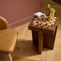 a chair and table with chess pieces on it