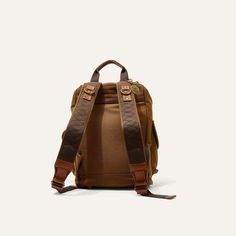 Built to travel with you everyday, with tons of space and a padded back, our rugged Lennon Backpack is comfortable and sturdy enough to tag along no matter where you are headed. Equally as suited for the office as it is for the trail. Constructed from full grain vegetable tanned leather and 18 oz 100% cotton canvas the bag is built to last and will only get better with age. Dimensions: 12” x 16” x 8.5” Weight: Approx. 4 lbs Full-grain vegetable-tanned leather & 18 oz. cotton canvas Interior lapt Casual Brown Travel Backpack, Travel Leather Backpack In Cognac With Leather Handles, Brown Standard Backpack Travel Bag For Everyday, Cognac Leather Backpack With Leather Handles For Travel, Brown Everyday Standard Backpack Travel Bag, Brown Leather Backpack With Adjustable Strap For Everyday, Brown Leather Backpack With Leather Trim For Daily Use, Outdoor Brown Backpack With Leather Backing, Rugged Travel Shoulder Bag With Leather Trim