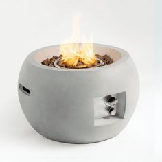 an outdoor fire pit is shown with flames coming out of the top and side sides