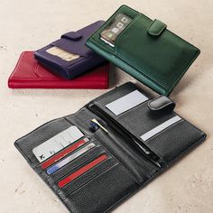 A convenient RFID-protected leather wallet made for the savvy traveler. Keep your travel documents and smartphone ready to go in our Getaway Wallet, crafted in softly pebbled full-grain leather. With plenty of card, cash and ticket pocketing and a secure tab closure, you can keep exactly what you need at your fingertips as you go through airport checkpoints. It features a pen sleeve so you can take your favorite pen with you and take notes on the 3 x 5 note cards included. Add a monogram for a p Luxury Travel Wallet With Zipper Closure, Luxury Blue Wallets For Travel, Luxury Black Trifold Travel Wallet, Leather Trifold Wallet With Hidden Phone Sleeve For Travel, Trifold Wallet With Interior Card Slots For Travel, Versatile Travel Wallets With Interior Card Slots, Versatile Travel Wallet With Interior Card Slots, Versatile Leather Wallet With Hidden Phone Sleeve, Classic Travel Wallets With Cell Phone Pocket