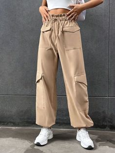 Stay comfortable and stylish with these Elastic Knot Detail Pants with Pocket. These pants feature an elastic waistband with a knot detail, adding a trendy and chic element to the design. The pocket provides functional storage space while enhancing the overall style. Whether you pair them with a casual tee or a flowy blouse, these elastic knot detail pants with pocket will give you a fashionable and effortless look. Specifications: Style: Casual Type: Cargo Pants Details: Knot, Pocket, Paperbag Trendy Tie Waist Pants, Versatile Ankle-length Harem Pants With Pockets, Trendy Solid Bottoms With Tie Waist, Versatile Baggy Harem Pants With Pockets, Beige High-waisted Parachute Pants With Pockets, Trendy Baggy Harem Pants With Pockets, Chic Baggy Harem Pants With Pockets, Chic Harem Pants With Pockets For Workwear, Chic Khaki Bottoms With Side Pockets