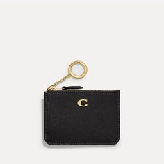 A classic design for life on the go, Coach's Mini ID wallet keeps smaller payment essentials sleekly stowed away. Styled into a compact pocket size, it is made from black crossgrain leather with two card slots, a receipt pocket and a zipped compartment for coins. The ubiquitous 'C' monogram sits at the front in gold-tone detail along with a O-ring purse charm. Modern Coach Wallet For Everyday Use, Classic Coach Card Holder For Travel, Classic Compact Coach Coin Purse, Classic Coach Coin Purse With Coin Pocket, Classic Coach Coin Purse, Coach Rfid Blocking Card Holder For Travel, Coach Travel Card Holder With Rfid Blocking, Classic Coach Wallets For Everyday Use, Classic Coach Everyday Wallets