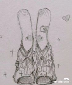 two pairs of shoes are drawn in pencil on paper with hearts and crosses around them