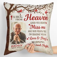 a person holding up a pillow with the message, a hug from heaven when you really miss me