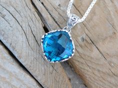 "Two London blue topaz necklaces...1 1/8\" tall with bail by 5/8\" wide at the widest spot, cast in sterling silver 925 with a beautiful 14mm by 14mm cushion cut London blue topaz stone...the chain is 18\" with a lobster catch also in sterling silver 925..regular price for one necklace $86.00 sale price $70.52" Sterling Silver Cushion Cut Necklace, Silver Blue Topaz Cushion Cut Jewelry, Silver Topaz Cushion Cut Jewelry, Cushion Cut Sapphire Sterling Silver Jewelry, Cushion Cut Sapphire Jewelry In Sterling Silver, Blue Cushion Cut Sterling Silver Jewelry, London Blue Topaz Necklace, Blue Topaz Necklace, Topaz Necklace