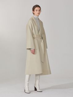 Editor's NotesThis oversized fit raglan sleeve coat made from cashmere wool blend has elegant loose silhouette expressing chic sophisticated mood. The belt helps creating different silhouettes with slender waist line.- Woolmark certified cashmere wool blend- Subtle shine and soft texture- Double layered fabric- Curved shoulder line- Self fabric belt- Reversible design- Side pockets on one side and patch pockets on the other- Notched collarMeasurements(in.)36(S) / 38(M)- Chest: 21.73 in. / 22.76 in.- Neck to Sleeve Length: 28.94 in. / 29.69 in. - Total Length: 45.51 in. / 46.50 in.* Model Info: Height 5' 9.5 , Bust 31.10 in., Waist 22.83 in., Hip 35.04 in. / Fitting size MComposition & Care- 30% Cashmere, 70% Wool- Dry cleaning onlyDesigner- by MUSEE Raglan Sleeve Coat, What Women Want, The Mill, W Concept, Fabric Belt, Cashmere Wool, Waist Line, Mens Outerwear, Wool Coat