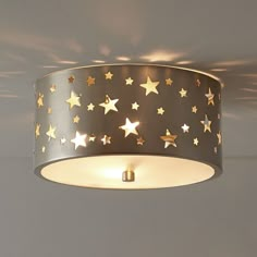 a ceiling light that has stars on it