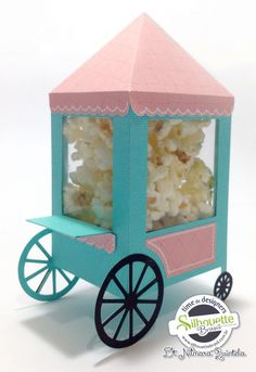 a small cart with popcorn in it