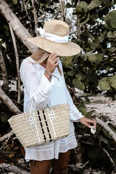 Straw panama hat with a white grosgrain tie. Made of natural straw, The Everywhere Hat has a wide brim that protects you from the sun while looking casual and modern. The adjustable grosgrain ribbon can be custom tied for a perfect fit to your head size, plus it adds the perfectly sweet accent to pair with breezy outfits for a stylish sunny look. Content:- Raffia Straw- Imported Size:- One Size Fits All, Adjustable- Crown: 5.5"- Brim: 4" Straw Panama Hat, Breezy Outfit, Custom Ties, Summer Look, Wide Brimmed, Straw Hat, Grosgrain Ribbon, Summer Looks, Panama Hat