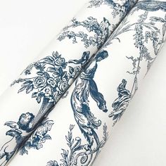 two blue and white toiler printed curtains