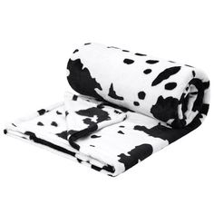 a black and white cow print blanket