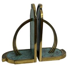 pair of art deco bookends in brass and green pattered metal, circa 1950