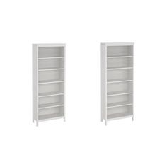 two white bookshelves sitting next to each other