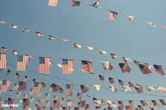 many american flags are hanging from a line