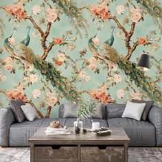 a living room with floral wallpaper and two peacocks