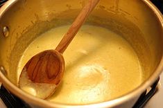 a wooden spoon in a pot on the stove