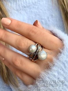 Description : Pearl Stone Cross Silver Ring, Pearl Silver Ring, Pearl Ring, 925 Sterling Silver Ring, Authentic Ring, Mother Day Ring, christmas day gift pearl ring, Five Stone Ring, coral pearl ring, mother of pearl ring, 925 silver pearl, pearl silver ring, sterling silver ring, white pearl ring, freshwater pearl, mother of pearl, multi stone ring, pearl ring silver, silver pearl ring Handmade item Materials: Pearl , Silver Gemstone: Pearl,  Gem color: White Band color: Silver/Gold Style: Minimalist Recycled Silver Sterling Pearl Ring, Adjustable Silver Pearl Promise Ring, White Nickel-free Rings For Anniversary, Silver Stackable Open Pearl Ring, White Open Ring Stackable Rings For Anniversary, White Sterling Silver Stackable Open Rings, White Stackable Rings For Anniversary With Open Design, White Stackable Open Rings For Anniversary, Silver Open Pearl Ring For Everyday