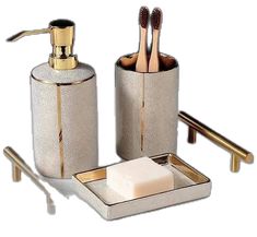 a bathroom set with toothbrushes and soap dispenser