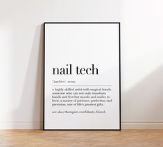 a black and white poster with the words nail tech on it next to a wooden floor