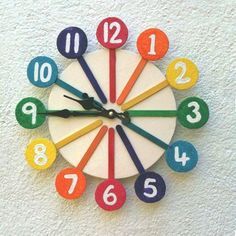 a colorful clock with numbers on the face