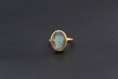 ♦♦ Beautiful handcrafted ring ◘Stone Information: Genuine Labradorite - Color: Purple Cut: Oval Cabochon Size: 13X18 mm ◘ Metal: 925 Sterling Silver ◘ Band: 1.5 mm ◘ Setting: Open back bezel setting ◘ Finish: High polish (shiny) ◘ Nickel free ◘ Handmade band: 14 gauge solid sterling wire This ring is adorably rustic, easy to wear, & stackable! ◘Please Note - The Ring in the Picture can be available or Sold out. Every Ring is Made of a Unique Gemstone. Therefore, Colors and Inclusions of the Handmade Dainty Oval Rings, Dainty Handmade Oval Rings, Elegant Labradorite Gemstone Ring, Elegant Labradorite Crystal Ring As Gift, Handmade Labradorite Wedding Jewelry, Handmade Labradorite Jewelry For Wedding, Labradorite Rings With Natural Stones For Gift, Oval Labradorite Wedding Jewelry, Etsy Gold Ring