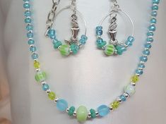 "Blue Beaded Necklace *FREE SHIPPING*/Silver Jewelry Unique Silver, Blue, Sea foam Green, Choker with Czech Glass Beads. This beach inspired Choker are sure to be a hit this summer with you or as a great thoughtful gift! The choker will fit necks from 13\" inches up to 16\" inches. Length of the choker 13\" to 15\" inches, allowing chain dangle on end, depending on where you hook the clasp on the extension chain. Hypoallergenic to eliminate irritation/ Excellent customer reviews/Handmade in the Blue Jewelry With Silver Beads For Summer, Handmade Silver Beaded Necklaces For Summer, Blue Jewelry With Silver Beads For The Beach, Handmade Silver Beaded Necklace For Summer, Blue Jewelry With Lobster Clasp For Summer, Handmade Silver Jewelry For Beach Season, Blue Round Beads Jewelry For Beach Season, Turquoise Jewelry With Spacer Beads For Summer, Handmade Silver Beaded Necklace For Beach