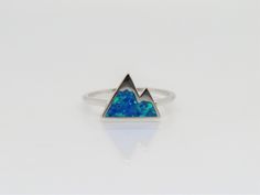 Vintage Sterling Silver Blue Opal Mountain Ring...Marked 925...Total of weights 1.4grams... Size 7...Measure of Face 9.5MM...It's in very good condition. B Blue Sterling Silver Opal Promise Ring, Blue Opal Ring Stamped 925 For Gift, Mountain Ring, Blue Opal, Silver Blue, Vintage Sterling Silver, Opal, Enamel Pins, Ring Size