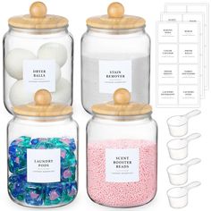 three glass jars filled with different types of candy