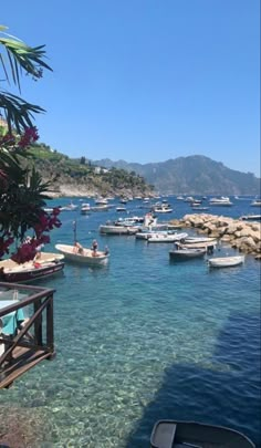 boats are docked in the clear blue water